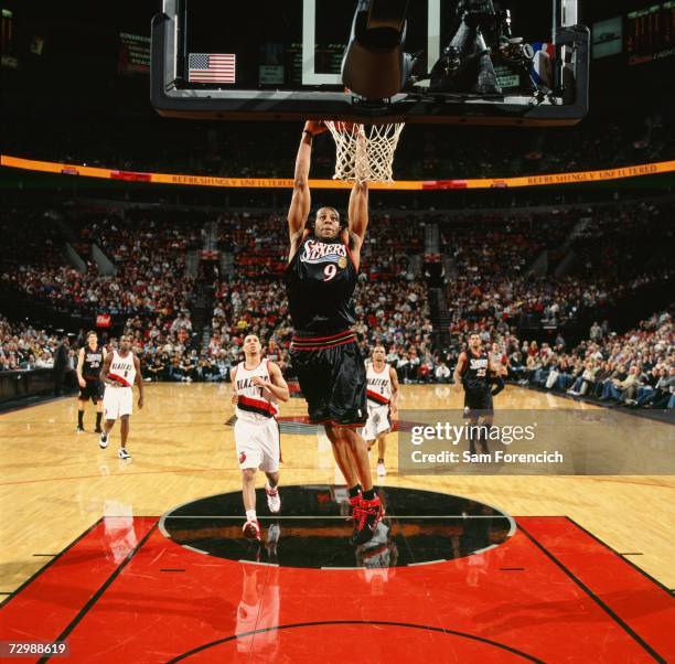 Andre Iguodala of the Philadelphia 76ers elevates for a dunk during a game against the Portland Trail Blazers at The Rose Garden on December 29, 2006...