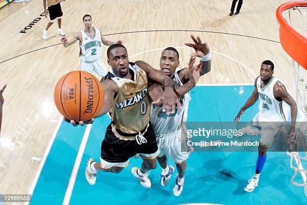 Gilbert Arenas of the Washington Wizards shoots the ball against Rasual Butler of the New Orleans/Oklahoma City Hornets during an NBA game on January...