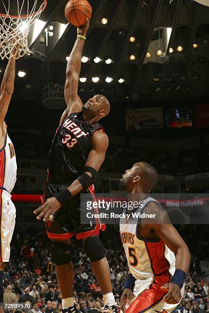 Alonzo Mourning of the Miami Heat goes up for the dunk against the Golden State Warriors at Oracle Arena January 12, 2007 in Oakland, California....