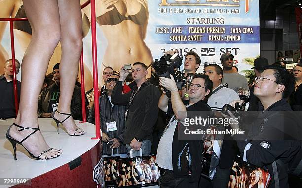 Fans watch adult film star Mary Carey dance at the Adult Video News Adult Entertainment Expo at the Sands Expo Center January 12, 2007 in Las Vegas,...