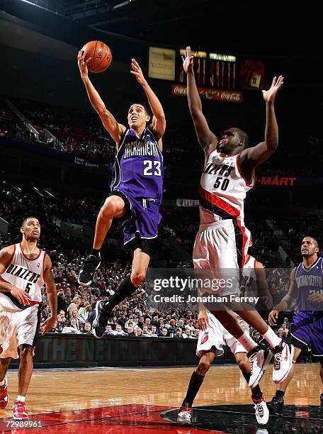 Kevin Martin of the Sacramento Kings lays up the ball against Zach Randolph of the Portland Trail Blazers on January 12, 2007 at the Rose Garden in...