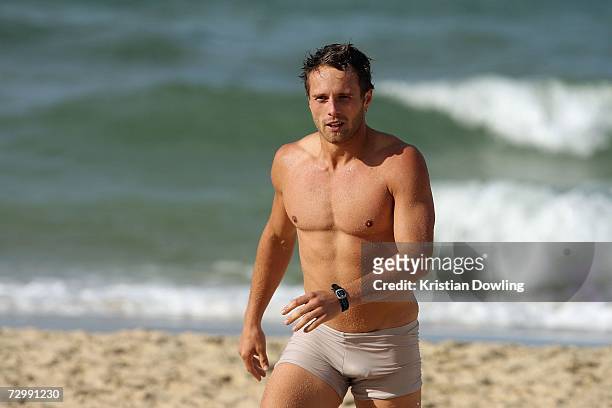 Brad Sewell of the Hawks walks on the beach during a recovery session at Albert Park Beach after a Hawthorn Hawks AFL training session on January 13,...