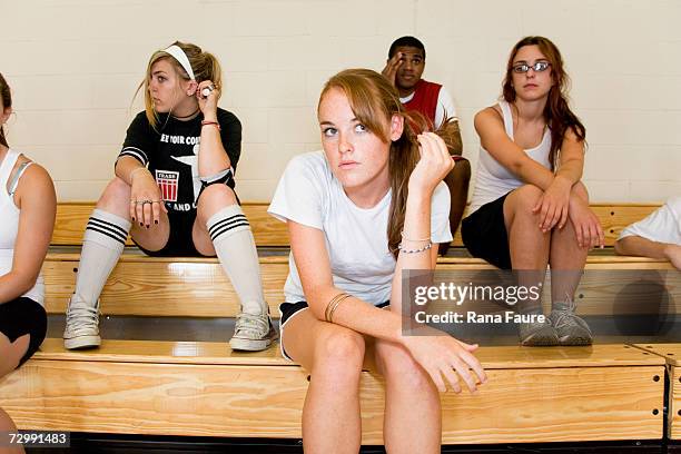 group of students (16-19) sitting on bleachers in school gym - girl in gym stock pictures, royalty-free photos & images