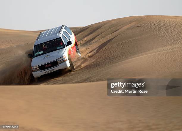 Four wheel drive Jeep drives through the dunes with players of Bayern Munich during the Bayern Munich desert tour on January 13, 2007 in Dubai,...