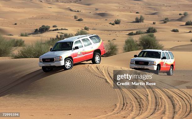 Four wheel drive Jeep drives through the dunes with players of Bayern Munich during the Bayern Munich desert tour on January 13, 2007 in Dubai,...