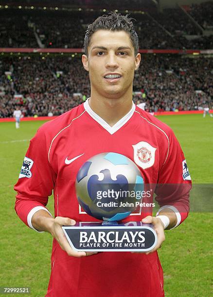 Cristiano Ronaldo of Manchester United poses with his Barclays Player of the Month award for December 2006 ahead of the Barclays Premiership match...