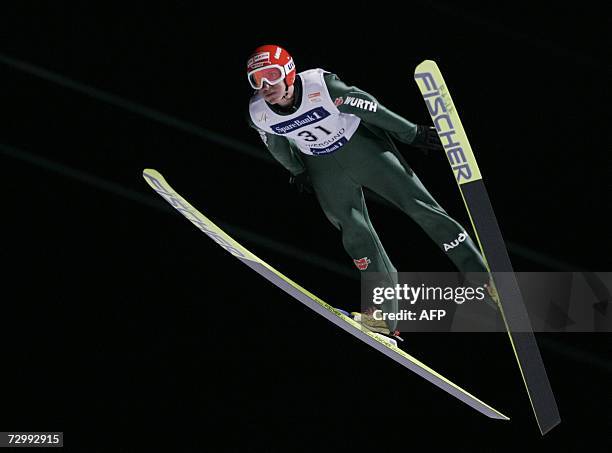 Germany's Michael Uhrmann airbornes to place 9th in the Ski Jumping World Cup in Vikersund, 13 January 2007 . AFP PHOTO / Terje Bendiksby / SCANPIX...