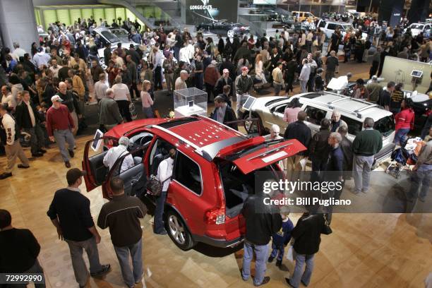 Thousands of people crowd the display floor at the opening of the 2007 North American International Auto Show January 13, 2007 in Detroit, Michigan....