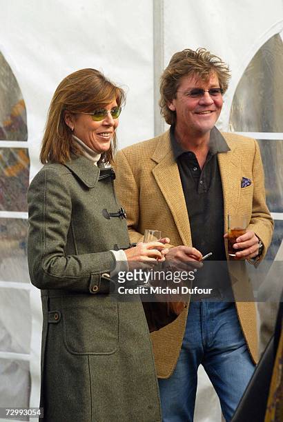 Princess Caroline of Monaco, a member of the Grimaldi family, stands with her third husband, Ernst August V of Hanover in 2003 in Paris, France....