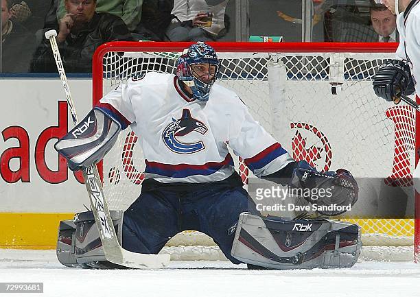 Roberto Luongo of the Vancouver Canucks gets into position to make a pad save on the Toronto Maple Leafs during their NHL game at the Air Canada...
