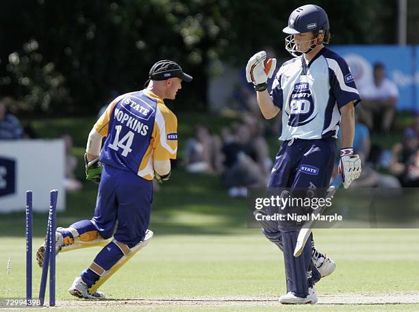 Rob Nicol looks at his stumps after being dismissed by Gareth Hopkins of Otago during the Twenty20 match between Auckland and Otago at the Eden Park...