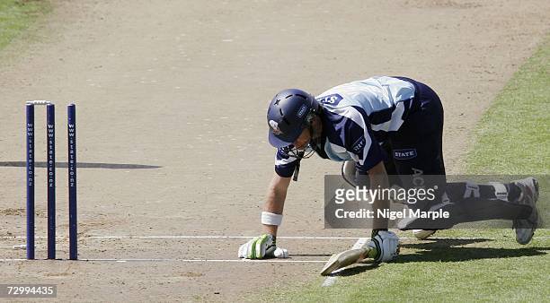Lou Vincent of Auckland struggles to regain his feet after being run out during the Twenty20 match between Auckland and Otago at the Eden Park Outer...