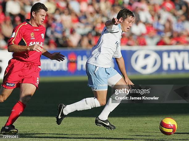 Mark Milligan of Sydney FC gets passed Carl Veart of United during the round 20 Hyundai A-League match between Adelaide United and Sydney FC at...