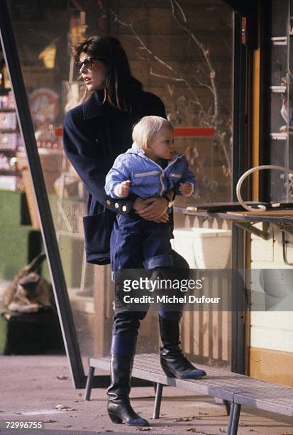 Princess Caroline of Monaco, a member of the Grimaldi family, carries her son Andrea Casiraghi, 1984 in Paris, France. Princess Caroline married...