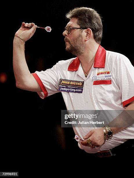 Martin Adams of England in action against Phil Nixon of England during the Final Of The BDO World Darts Championships at the Lakeside Country Club on...