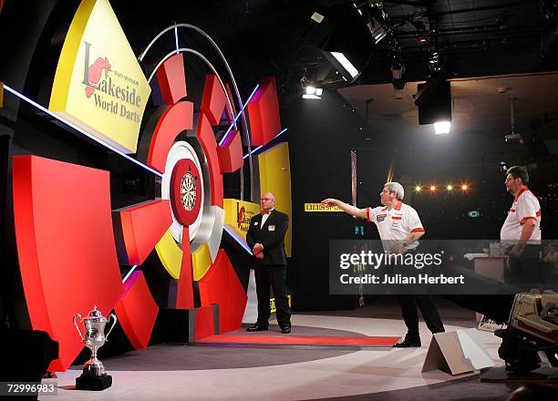Phil Nixon of England in action against Martin Adams of England during the Final Of The BDO World Darts Championships at the Lakeside Country Club on...