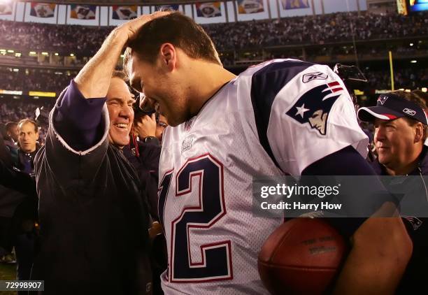 Head coach Bill Belichick and quarterback Tom Brady of the New England Patriots meet after the game against the San Diego Chargers after the AFC...