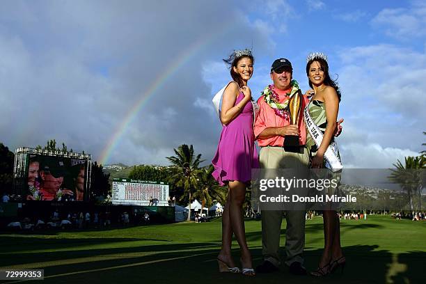 Paul Goydos holds the winner's trophy with Miss Hawaii 2006 Radasha Ho'ohuli and Miss Hawaii 2007, Chanel Wise after his 14-under par victory during...