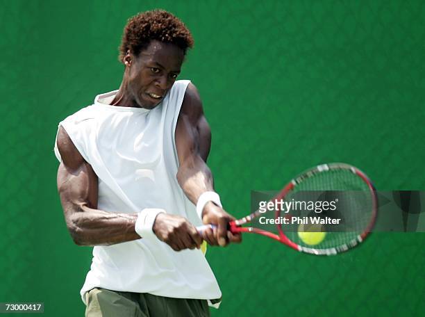 Gael Monfils of France plays a backhand during his first round match against Daniele Bracciali of Italy on day one of the Australian Open 2007 at...