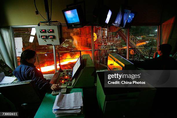 Worker controls the production of steel plates at a Shanghai Baosteel Group factory January 15, 2007 in Shanghai, China. According to state media,...