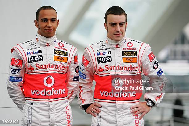 Lewis Hamilton of Great Britain and Fernando Alonso of Spain pose for the media during the launch of the Vodafone McLaren Mercedes 2007 MP4-22 F1...