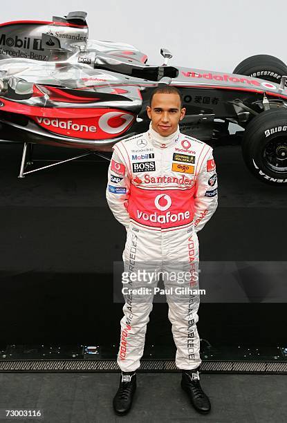 Lewis Hamilton of Great Britain poses for the media during the launch of the Vodafone McLaren Mercedes 2007 MP4-22 F1 challenger at L'Heisferic,...