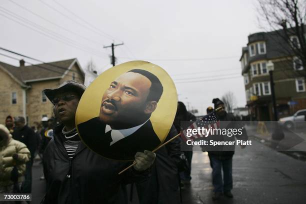 Residents march in a Martin Luther King Jr. Day parade January 15, 2007 in Bridgeport, Connecticut. King was assassinated in 1968 in Memphis and...