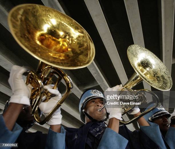 Members of Houston's Sterling High School marching band play under a freeway at the end of the Martin Luther King Jr. Grande Parade January 15, 2007...