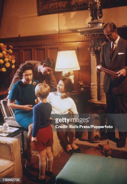 View of members of the British royal family relaxing together at Sandringham House in Norfolk, England during filming of the television documentary...