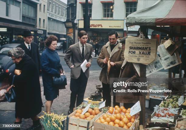 Prince Charles pictured buying fruit at a market stall in Cambridge whilst on a shopping expedition during filming of the television documentary...