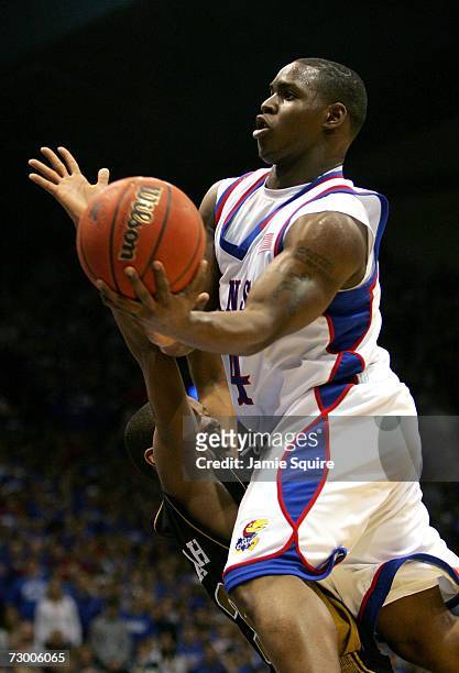 Sherron Collins of the Kansas Jayhawks shoots over Sefhon Hannah of the Missouri Tigers during the first half of the game January 15, 2007 at Allen...