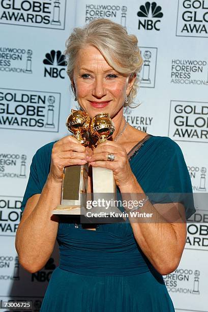 Actress Helen Mirren poses with her Best Performance by an Actress in a Motion Picture - Drama award for "The Queen" and Best Performance by an...