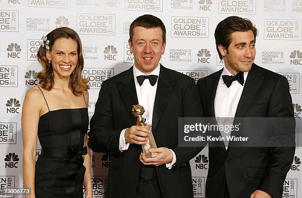 Presenter Hilary Swank, writer Peter Morgan with his Best Screenplay - Motion Picture award for "The Queen", and actor Jake Gyllenhaal pose backstage...