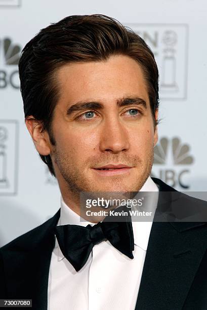 Actor Jake Gyllenhaal poses backstage after presenting writer Peter Morgan with his Best Screenplay - Motion Picture award for "The Queen" during the...