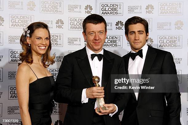 Presenter Hilary Swank, writer Peter Morgan with his Best Screenplay - Motion Picture award for "The Queen", and actor Jake Gyllenhaal pose backstage...