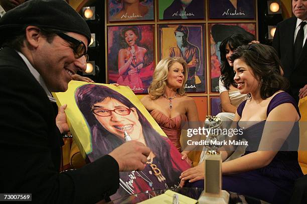 America Ferrera signs art work by pop artist Nicolosi on the Entertainment Tonight set after winning for the Best Performance by an Actress in a...