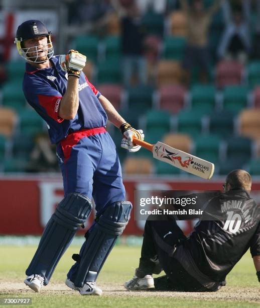Andrew Flintoff of England celebrates the winning runs as Craig McMillan of New Zealand looks on during game three of the Commonwealth Bank One Day...