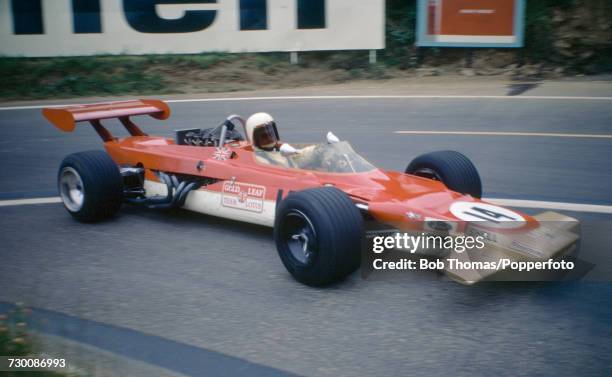 British racing driver John Miles drives the Gold Leaf Team Lotus Lotus 63 Cosworth V8 in the 1969 French Grand Prix at the Circuit de Charade...