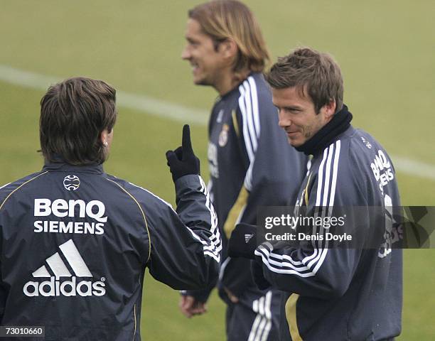 David Beckham of Real Madrid chats with Antonio Cassano at the start of a training session at Real's training grounds in Valdebebas on January 16,...