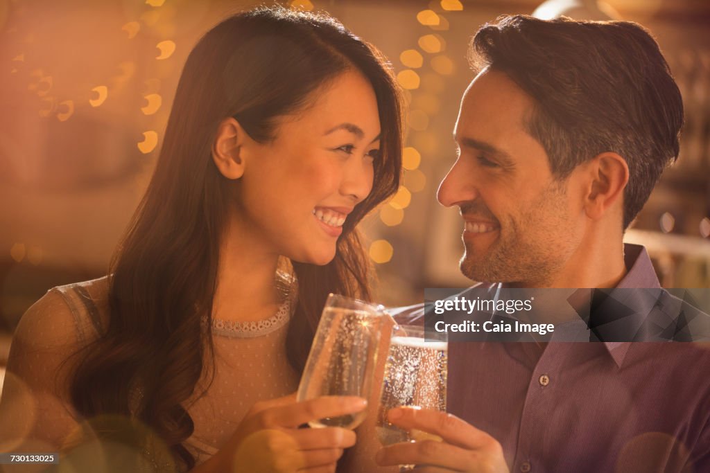 Couple toasting champagne flutes