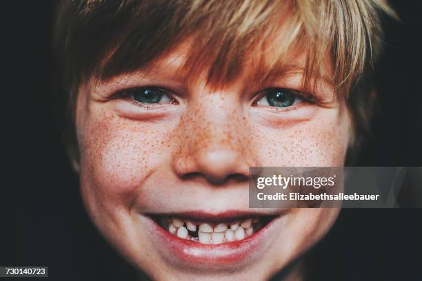 Portrait of a gap toothed smiling boy