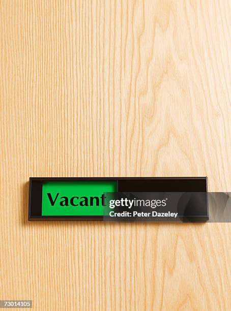 "vacant" sign on door, close-up - vacant or engaged sign stock pictures, royalty-free photos & images