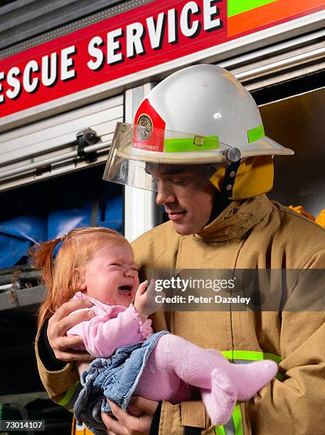 Fire Rescue Baby 38 Baby Fire Helmet Stock Photos, High-Res Pictures, and Images - Getty ...