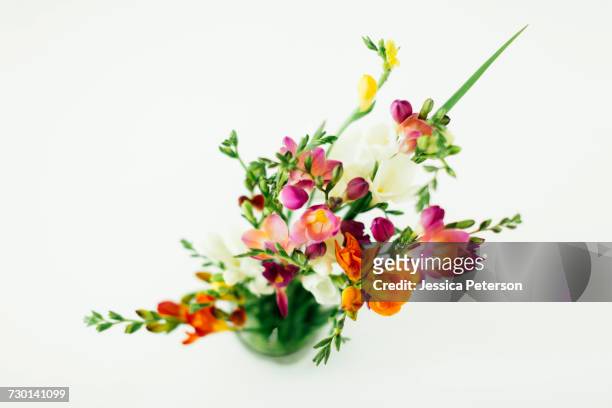 jar with bunch of flowers - freesia stock pictures, royalty-free photos & images