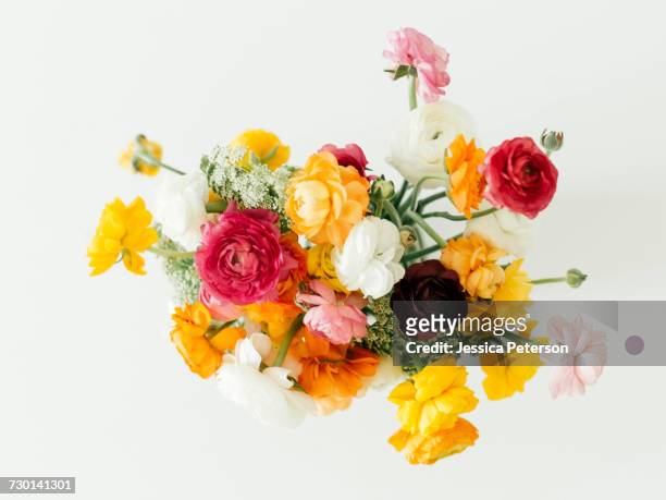bouquet of ranunculus flowers - flower arrangement stock pictures, royalty-free photos & images