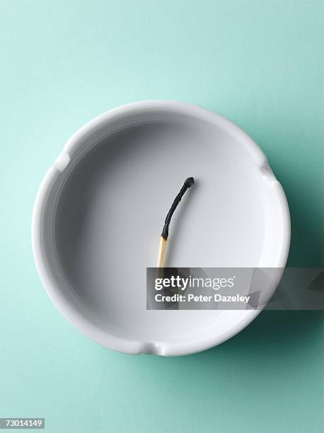 burnt matchstick in ashtray, overhead view - ashtray stock pictures, royalty-free photos & images