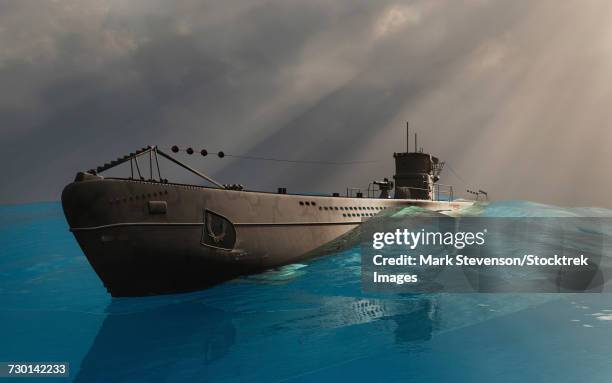 a nazi german u-boat sailing on the waters surface. - nazism stock illustrations