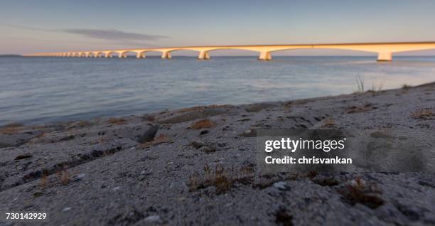 bridge at sunset, colijnsplaat, zeeland, holland - chrisvankan stock pictures, royalty-free photos & images