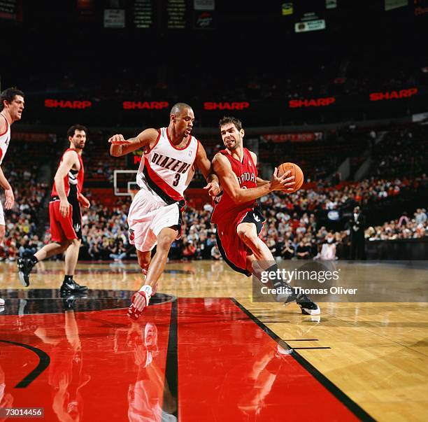 Jose Calderon of the Toronto Raptors drives to the basket against Juan Dixon of the Portland Trail Blazers during a game at The Rose Garden on...