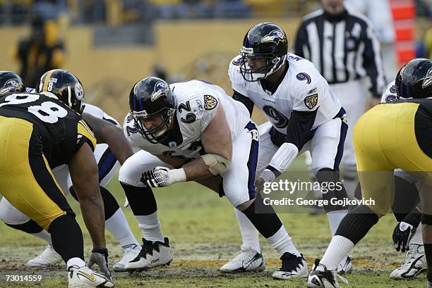 Quarterback Steve McNair of the Baltimore Ravens takes the ball from center Mike Flynn during a game against the Pittsburgh Steelers at Heinz Field...
